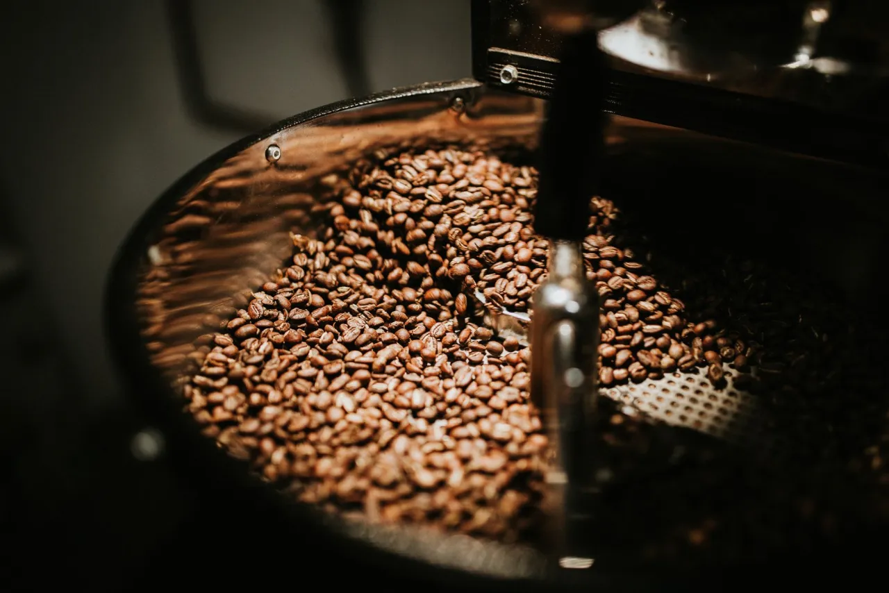 Freshly roasted coffee beans in the roaster